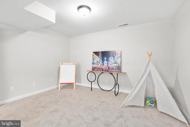 rec room with carpet floors and baseboards