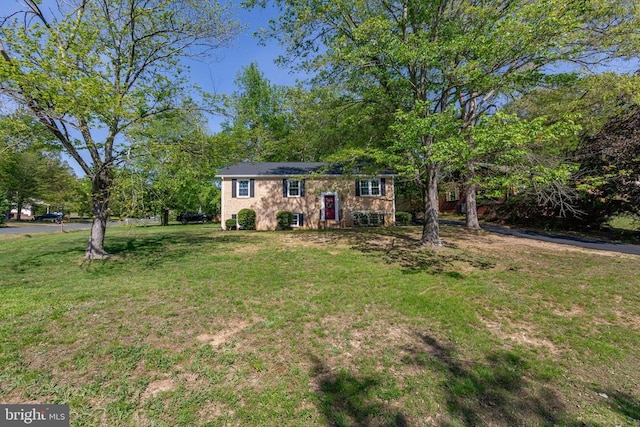 bi-level home with a front yard