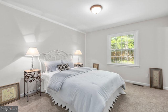 bedroom with carpet and baseboards