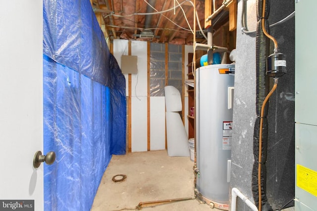 utility room featuring water heater