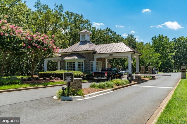 11109 Vanderbilt Cv, Spotsylvania, VA 22551 - view of asphalt road with curbs and a gated entry