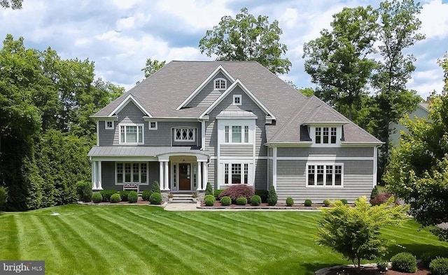 11109 Vanderbilt Cv, Spotsylvania, VA 22551 - view of front of property featuring a front lawn, a standing seam roof, a metal roof, and a shingled roof