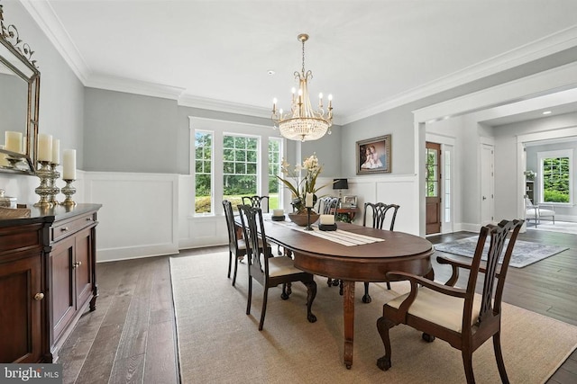 11109 Vanderbilt Cv, Spotsylvania, VA 22551 - dining room featuring a chandelier, hardwood / wood-style flooring, ornamental molding, wainscoting, and a decorative wall