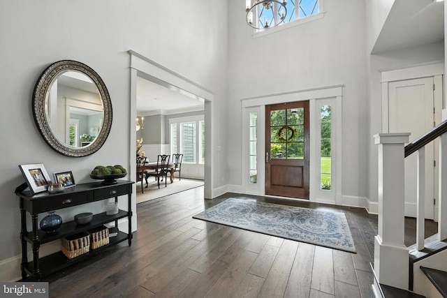 11109 Vanderbilt Cv, Spotsylvania, VA 22551 - foyer entrance with a chandelier, dark wood-style floors, a high ceiling, and stairway
