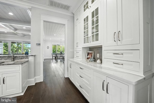 11109 Vanderbilt Cv, Spotsylvania, VA 22551 - bar area featuring dark wood-style floors, recessed lighting, beam ceiling, and decorative backsplash