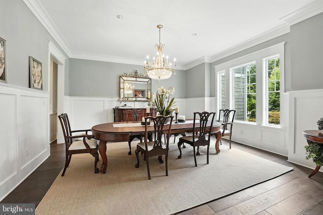 11109 Vanderbilt Cv, Spotsylvania, VA 22551 - dining room with a decorative wall, a wainscoted wall, ornamental molding, dark wood-style floors, and a chandelier