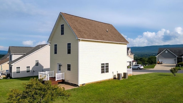 43 Upland Ct, Stuarts Draft, VA 24477 - view of side of home featuring a lawn, a deck, and a shingled roof