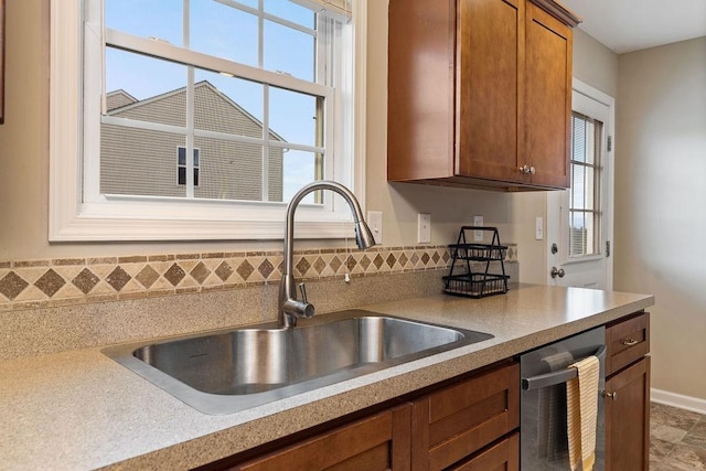 43 Upland Ct, Stuarts Draft, VA 24477 - kitchen featuring dishwasher, light countertops, and brown cabinets