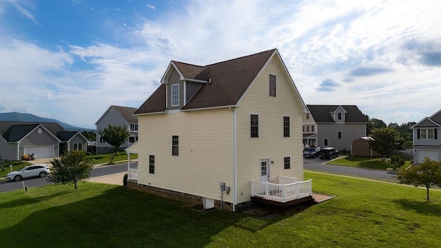 43 Upland Ct, Stuarts Draft, VA 24477 - view of side of home with a residential view, a lawn, and roof with shingles