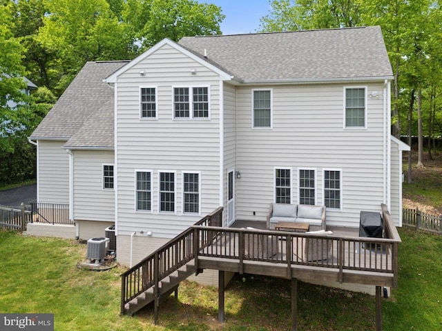 back of property with outdoor lounge area, a wooden deck, a shingled roof, and central air condition unit