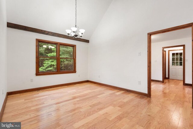15395 Rillhurst Dr, Culpeper, VA 22701 - unfurnished room with light wood finished floors, a chandelier, high vaulted ceiling, and baseboards