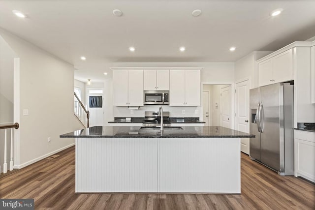 6520 Wild Orchid Ct, Fredericksburg, VA 22407 - kitchen with appliances with stainless steel finishes, a sink, an island with sink, dark wood finished floors, and recessed lighting