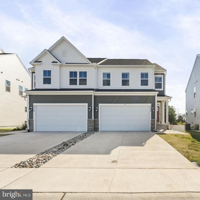 6520 Wild Orchid Ct, Fredericksburg, VA 22407 - view of front facade featuring a garage, concrete driveway, stone siding, and central air condition unit