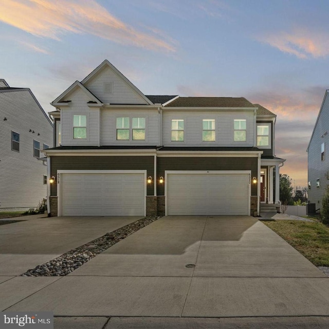 6520 Wild Orchid Ct, Fredericksburg, VA 22407 - view of front of property featuring an attached garage, concrete driveway, and stone siding