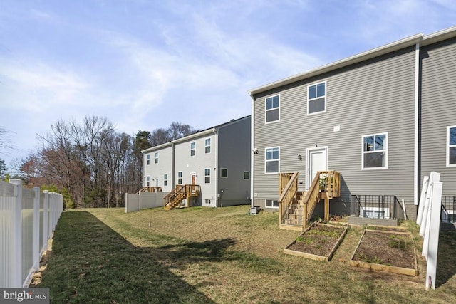 6520 Wild Orchid Ct, Fredericksburg, VA 22407 - rear view of property featuring a garden and stairs