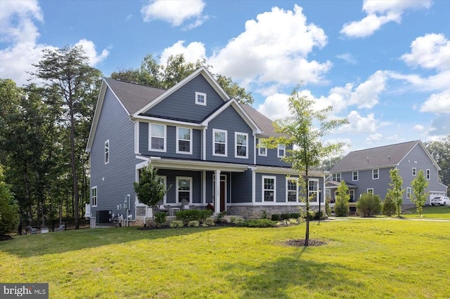11326 Oakville Ln, Spotsylvania, VA 22551 - craftsman-style house featuring covered porch, a front yard, and stone siding
