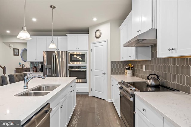 11326 Oakville Ln, Spotsylvania, VA 22551 - kitchen featuring appliances with stainless steel finishes, under cabinet range hood, dark wood-style floors, white cabinets, and recessed lighting