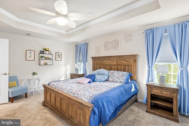 11326 Oakville Ln, Spotsylvania, VA 22551 - bedroom with a tray ceiling, light colored carpet, ornamental molding, and a ceiling fan