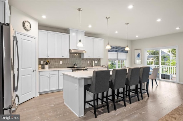 11326 Oakville Ln, Spotsylvania, VA 22551 - kitchen featuring appliances with stainless steel finishes, light wood-type flooring, white cabinetry, light countertops, and recessed lighting