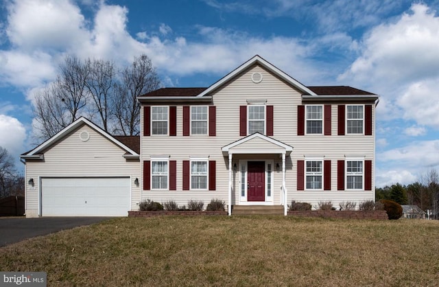 10501 Crestfield Ln, Spotsylvania, VA 22553 - colonial home featuring asphalt driveway, an attached garage, and a front lawn