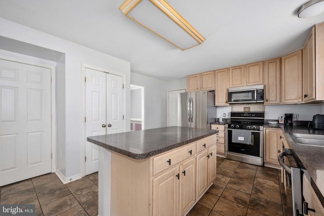 10501 Crestfield Ln, Spotsylvania, VA 22553 - kitchen featuring stainless steel appliances, light brown cabinets, dark countertops, baseboards, and a center island