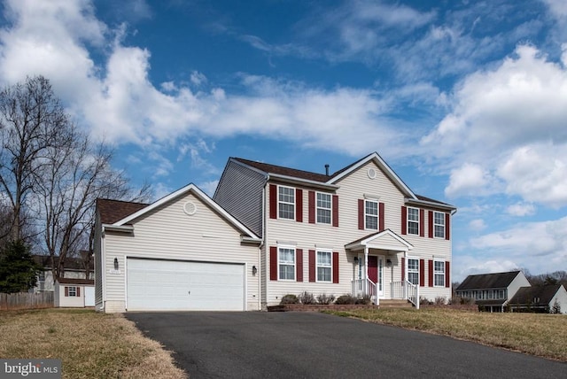 10501 Crestfield Ln, Spotsylvania, VA 22553 - colonial house featuring asphalt driveway and a garage