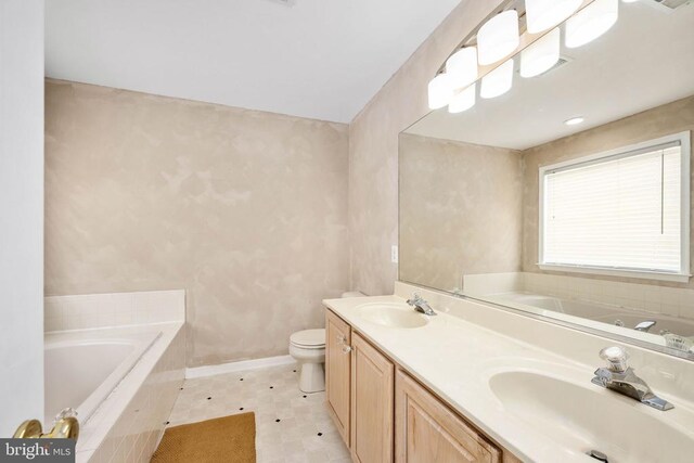 10501 Crestfield Ln, Spotsylvania, VA 22553 - bathroom with a bath, toilet, double vanity, and baseboards