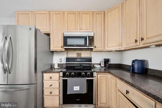 10501 Crestfield Ln, Spotsylvania, VA 22553 - kitchen with appliances with stainless steel finishes, light brown cabinets, and dark countertops
