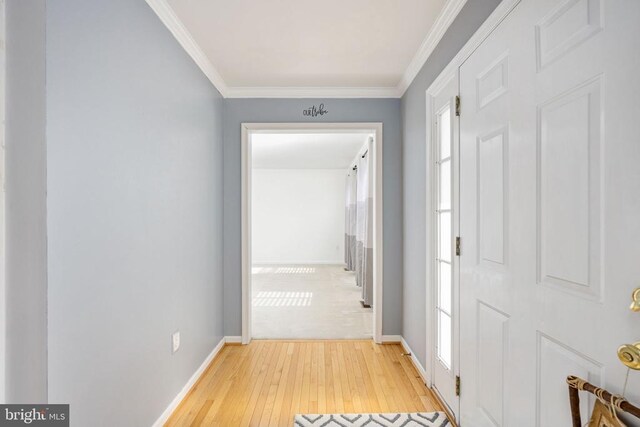 10501 Crestfield Ln, Spotsylvania, VA 22553 - hall featuring light wood finished floors, crown molding, and baseboards