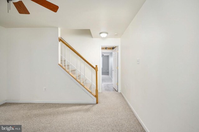 10501 Crestfield Ln, Spotsylvania, VA 22553 - carpeted spare room featuring a ceiling fan, stairs, and baseboards