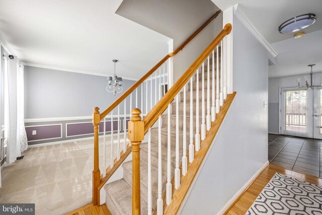 10501 Crestfield Ln, Spotsylvania, VA 22553 - staircase with a chandelier, ornamental molding, baseboards, and wood finished floors