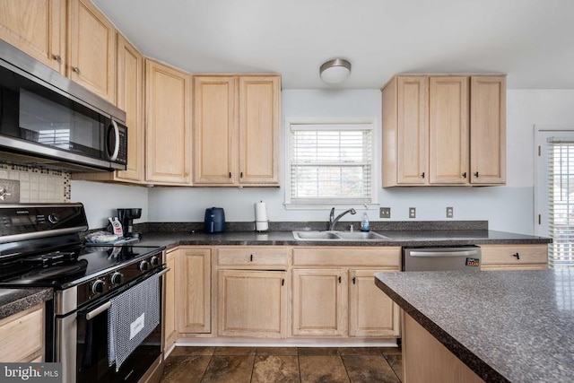 10501 Crestfield Ln, Spotsylvania, VA 22553 - kitchen with appliances with stainless steel finishes, light brown cabinetry, a sink, and dark countertops