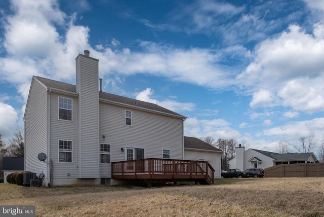 10501 Crestfield Ln, Spotsylvania, VA 22553 - back of house featuring a chimney, a deck, central AC, and fence