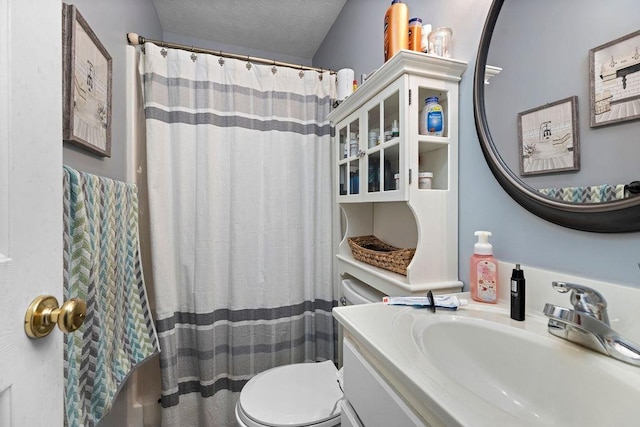 1294 Victorian Village Dr, Harrisonburg, VA 22802 - bathroom with toilet, vanity, a textured ceiling, and curtained shower