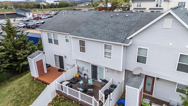 1294 Victorian Village Dr, Harrisonburg, VA 22802 - back of property featuring a deck, a shingled roof, and fence