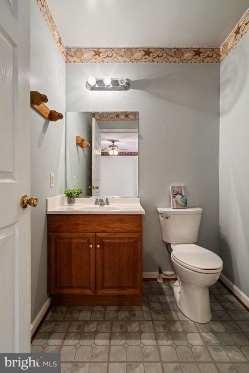 4117 Dartmoor Ct, Fredericksburg, VA 22408 - half bathroom with vanity, toilet, and baseboards