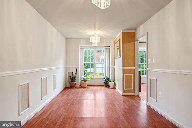4117 Dartmoor Ct, Fredericksburg, VA 22408 - empty room featuring a chandelier, wood finished floors, and baseboards