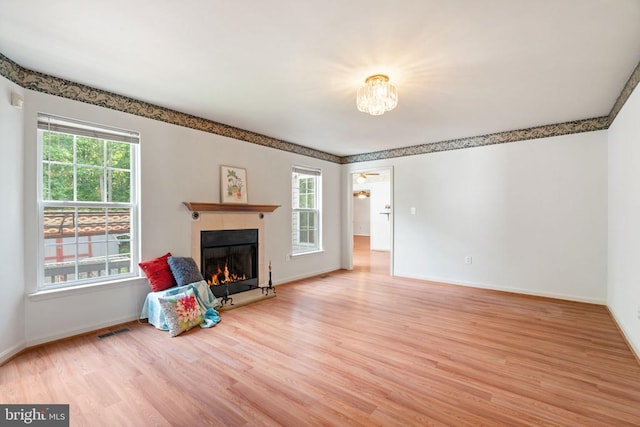 4117 Dartmoor Ct, Fredericksburg, VA 22408 - living room with healthy amount of natural light, wood finished floors, and a tile fireplace