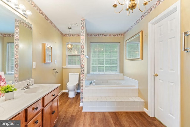 4117 Dartmoor Ct, Fredericksburg, VA 22408 - full bathroom with a bath, toilet, a chandelier, double vanity, and wood finished floors