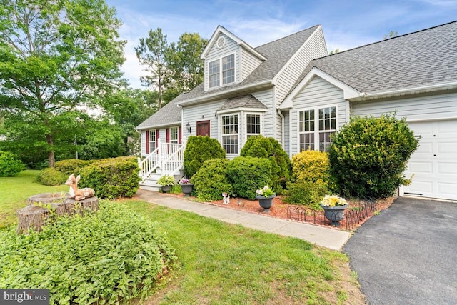 4117 Dartmoor Ct, Fredericksburg, VA 22408 - new england style home with a shingled roof, an attached garage, a front yard, and driveway