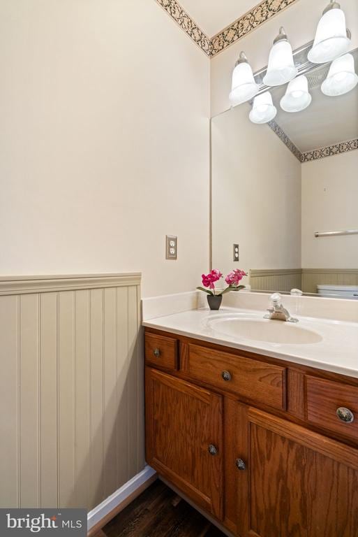 4117 Dartmoor Ct, Fredericksburg, VA 22408 - bathroom with vanity, a wainscoted wall, and wood finished floors