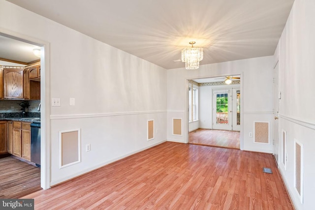 4117 Dartmoor Ct, Fredericksburg, VA 22408 - unfurnished dining area with a chandelier and light wood-style floors