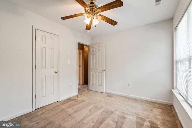 4117 Dartmoor Ct, Fredericksburg, VA 22408 - unfurnished bedroom with light carpet, baseboards, and a ceiling fan