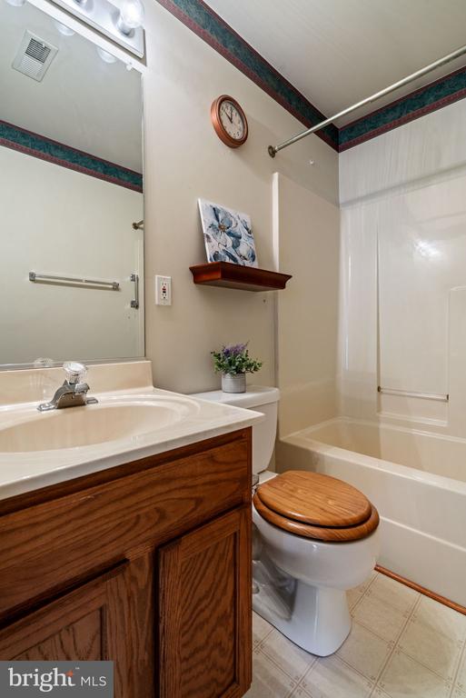 4117 Dartmoor Ct, Fredericksburg, VA 22408 - full bathroom with bathtub / shower combination, vanity, toilet, and tile patterned floors