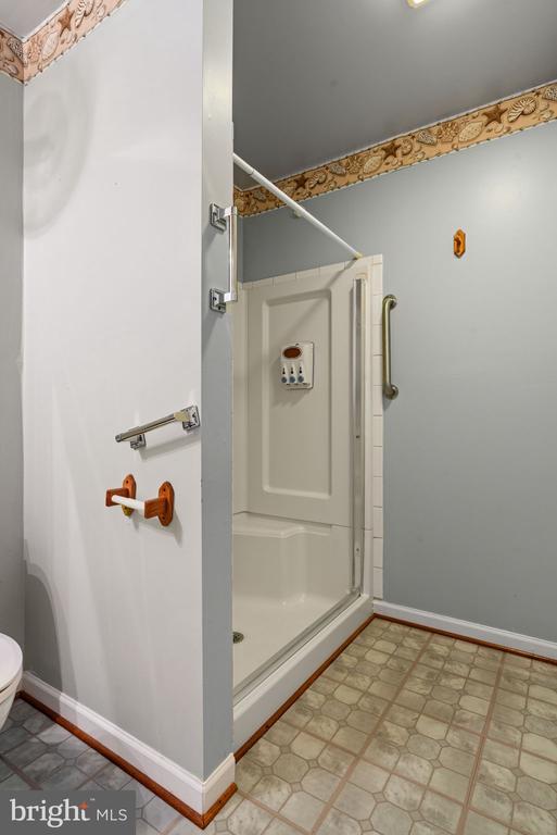 4117 Dartmoor Ct, Fredericksburg, VA 22408 - bathroom featuring a shower stall, baseboards, and toilet
