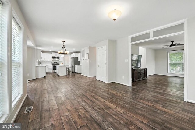 6205 Patrician Ct, Fredericksburg, VA 22407 - unfurnished living room featuring dark wood finished floors, a chandelier, a ceiling fan, and recessed lighting