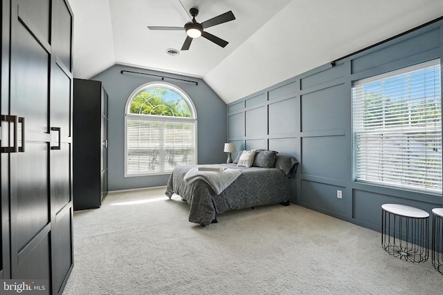 6205 Patrician Ct, Fredericksburg, VA 22407 - bedroom with a decorative wall, lofted ceiling, light carpet, and a ceiling fan