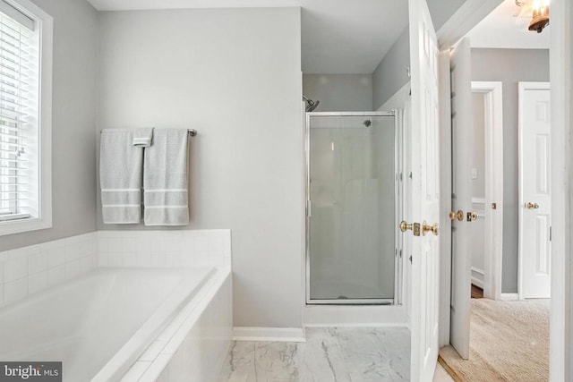 6205 Patrician Ct, Fredericksburg, VA 22407 - bathroom with healthy amount of natural light, a stall shower, a garden tub, and marble look tiles