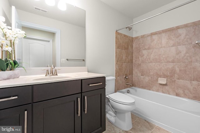 bathroom featuring tile patterned flooring, toilet, bathing tub / shower combination, vanity, and visible vents