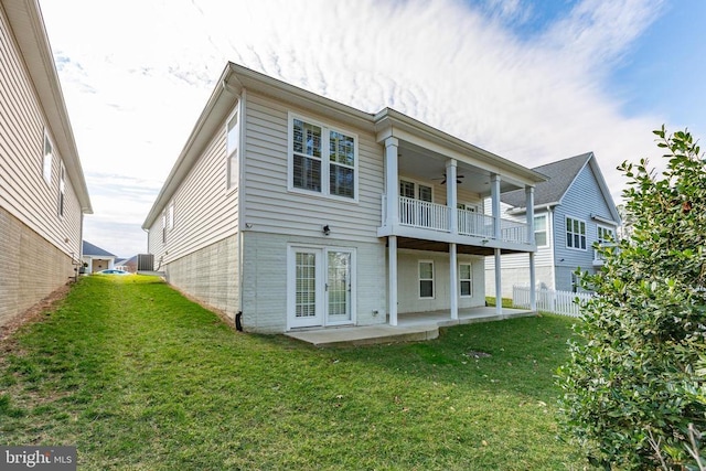 back of house with a ceiling fan, a yard, fence, and a patio